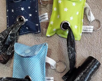 Fabric 'poo' bag holder.  Made from fun beautiful fabric.  Room for 2 poo bag rolls. Comes with hanging tag