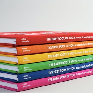 The Baby Book of You shown in all six rainbow colours. This modern baby memory journal is available in red, orange, yellow, green, blue, and pink. Perfect gift for new baby boy or ideal new baby girl present.