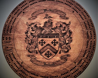 May include: A wooden cribbage board with a personalized crest featuring the Walker family name, a coat of arms, and the text "Ireland". The board has a circular shape with a dark brown stain and a light brown wood grain.
