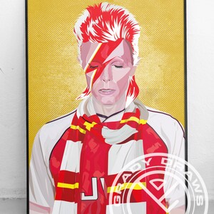 May include: A digital illustration of David Bowie wearing a red and white scarf with the letter "J" on the front. The background is a yellow color with a textured pattern. The image is framed in black.
