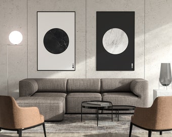 May include: A modern living room interior with a gray sectional sofa, two armchairs, two coffee tables, a floor lamp, and two framed prints with black and white circles on a gray concrete wall.