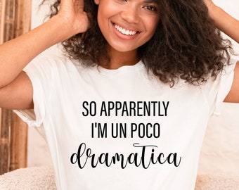 May include: A white t-shirt with black text that reads "So apparently I'm un poco dramatica".