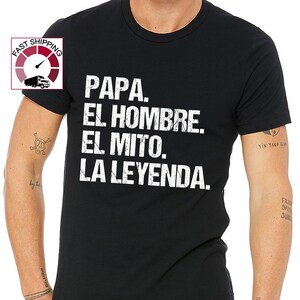 May include: Black crew neck t-shirt with white text that reads "PAPA. EL HOMBRE. EL MITO. LA LEYENDA." The shirt is made of a soft material. The image also includes a "Fast Shipping" graphic.