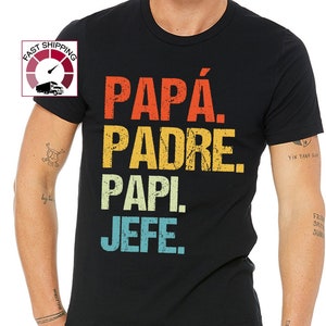 May include: Black t-shirt with a vintage-style graphic that reads "PAPÁ. PADRE. PAPI. JEFE."