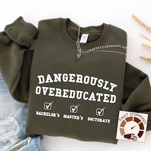 May include: A green sweatshirt with the text "Dangerously Overeducated" and checkboxes for "Bachelor's", "Master's", and "Doctorate".