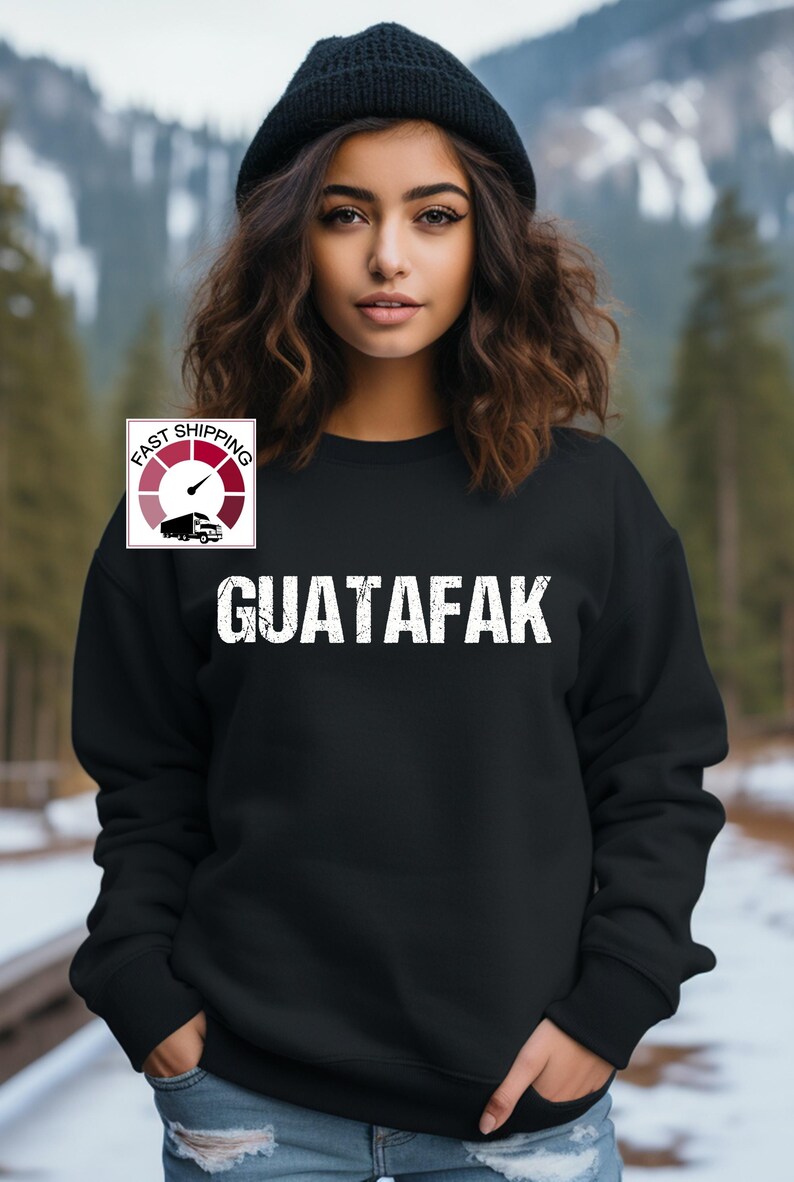 May include: Black sweatshirt with white text that reads "GUATAFAK" and a small graphic of a truck with a speedometer that says "FAST SHIPPING".