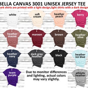 May include: A chart showing 12 different Bella Canvas 3001 Unisex Jersey Tee shirt colors. The colors are: white, soft cream, heather peach, berry, heather mauve, maroon, brown, heather olive, heather navy, dark gray heather, black, heather ice blue, team purple, and athletic heather. The text "Due to monitor differences and lighting, actual colors may vary slightly." is at the bottom of the chart.