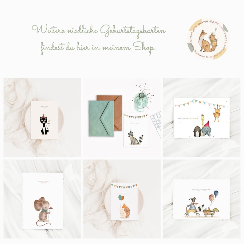 May include: Six different birthday cards featuring cute animal illustrations. The cards are on a white background with a light brown surface. The cards feature a cat, a raccoon, a giraffe, an elephant, a mouse, and a hedgehog.