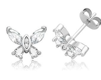 May include: A pair of silver butterfly stud earrings. Each earring has a butterfly design with clear, marquise-cut stones forming the wings and small round stones at the centre. The earrings are shown on a white background.