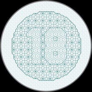 May include: A teal blue embroidery design of the number "18" on a white background. The design is surrounded by a repeating pattern of teal blue geometric shapes.