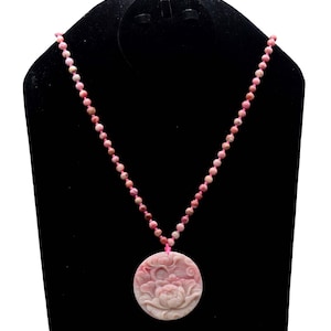 Pink Rhodonite Beaded Necklace With Round Pendant. Pendant Has Flower Carving