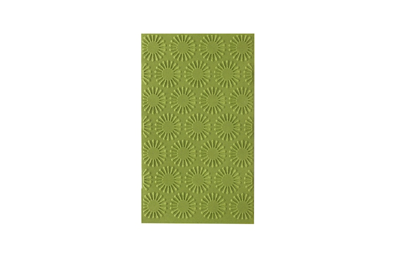 May include: A green embossed silicone baking mat with a repeating pattern of small circles with radiating lines.