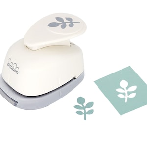 May include: White paper punch with a grey leaf design on the top. The punch is on a white background with a sample of the punched leaf design in grey on a light blue background.