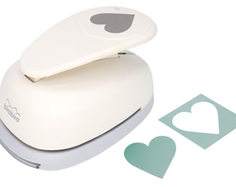 May include: White heart-shaped paper punch with a gray heart cutout. The punch is made by the brand "birabira". The image also shows two heart-shaped cutouts, one in a light green color and the other in white.