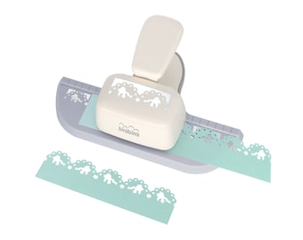 May include: A cream-colored paper punch with a scalloped edge design, cutting a light blue strip of paper. The punch has a lever and a gray base. The brand name "birabira" is visible on the punch.
