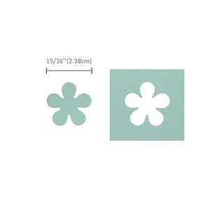 May include: A light blue square with a white flower cutout. The flower has six petals and a center circle. The square measures 15/16" (2.38 cm) across.