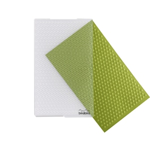 May include: A green and white plastic embossing mat with a raised dot pattern. The mat is designed for use with a craft machine to create textured effects on paper and other materials. The mat is labeled "birabira".