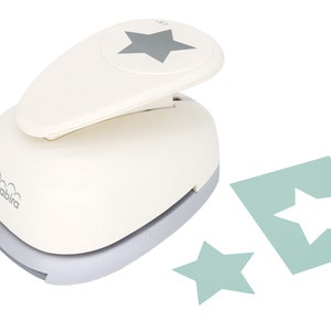 May include: A white paper punch with a gray star design on the top. The punch is used to create star-shaped cutouts from paper. Two star-shaped cutouts are shown in the image, one is a larger star and the other is a smaller star. The cutouts are a light green color.