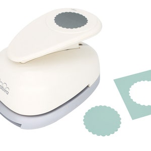 May include: A white and gray scalloped circle paper punch with a matching cut-out circle and a light blue paper. The punch has the brand name "birabira" printed on the side. The punch is designed for crafting and scrapbooking.