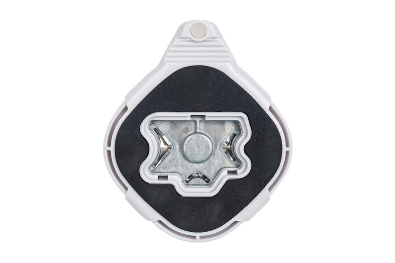 May include: White plastic base with a black rubber insert and a silver metal center. The base has a raised design on the top and a small hole in the center.