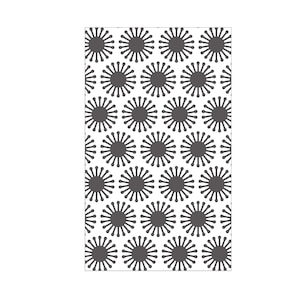 May include: A white background with a repeating pattern of dark grey stylised flowers. Each flower has a circle in the centre and 12 petals radiating outwards.