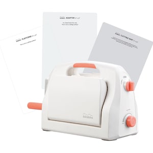 May include: A white die-cutting machine with a pink handle and pink knobs. The machine is on a white background with three white plastic sheets that say "Cricut PLATFORM 12" x 12", "Cricut ADAPTER 12" x 12", and "Cricut CUTTING MAT 12" x 12".