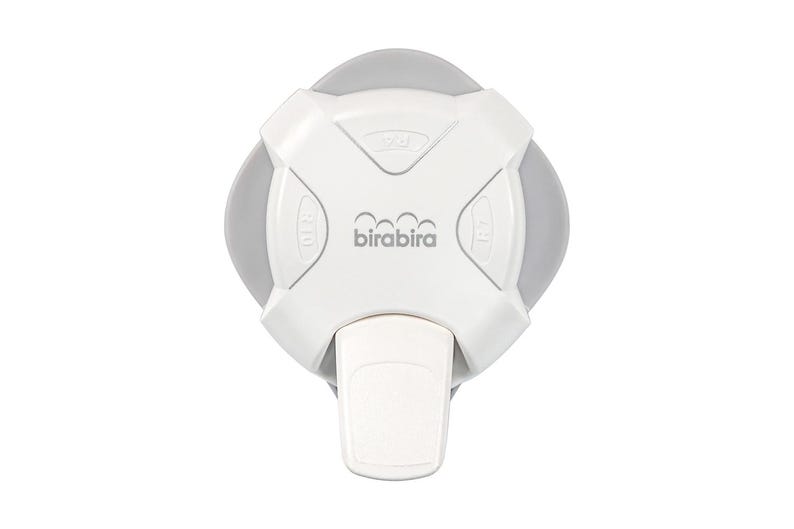 May include: White plastic baby bottle warmer with a gray base and a lever on the front. The warmer has a birabira logo and markings for 310, 220, and 170.