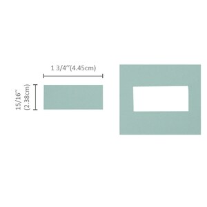 May include: A light blue rectangular wall plate with a rectangular cutout in the centre. The plate measures 1 3/4 inches by 15/16 inches.