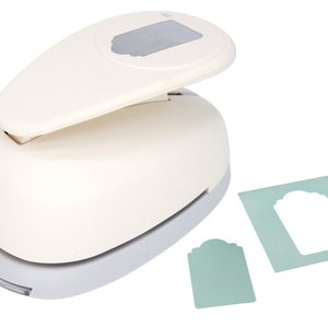 May include: White paper punch with a gray handle and a silver label that says "birabira". The punch is used to create a tag shape with a rounded top and a straight bottom. The punch is shown with a sample tag that has been punched out.