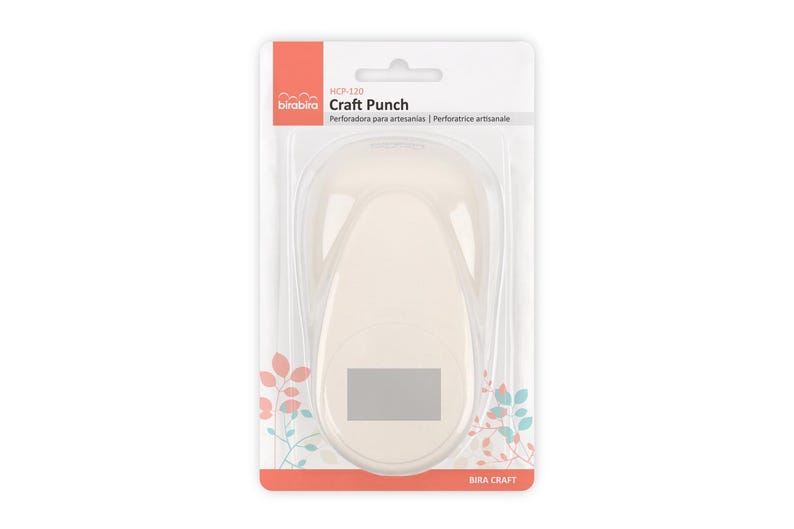 May include: A white craft punch packaged in a clear plastic blister pack with a pink and white label. The label reads "Craft Punch" and "bira craft".