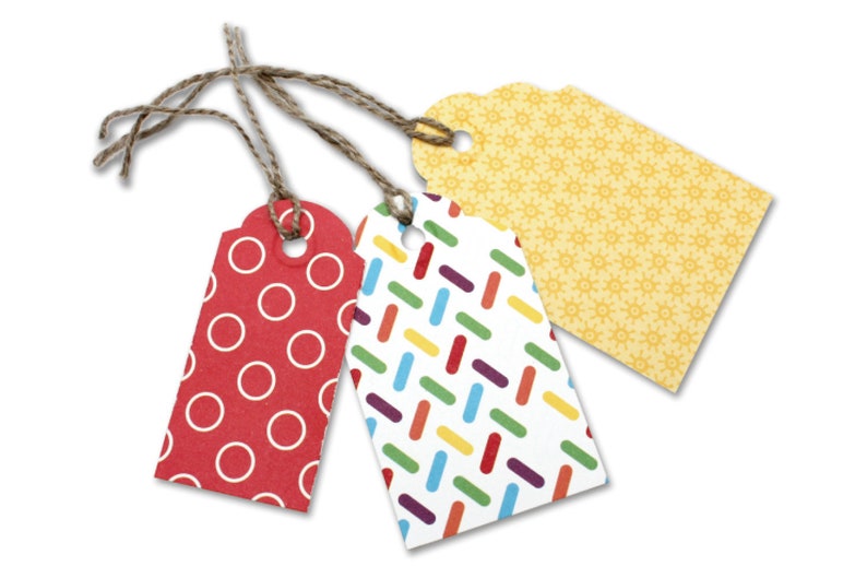 May include: Three gift tags with different patterns. The first tag is red with white polka dots, the second tag is white with colourful stripes, and the third tag is yellow with a small white floral pattern.