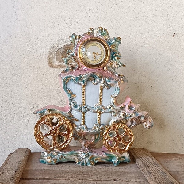 Large ceramic alarm clock depicting a carriage, working table clock, pink and light blue household items, kitsch statue