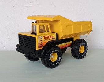Mighty Tonka Turbo-Diesel Truck XMB-975 , dump body, vintage toy truck , pressed steel , plastic , yellow and black