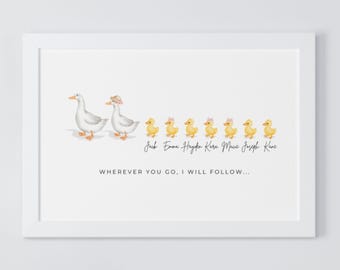May include: A white framed print with a watercolor illustration of two white ducks and seven yellow ducklings. The ducks are walking in a line with the text "Jack Emma Hayden Kara Muse Joseph Kare" and "WHEREVER YOU GO, I WILL FOLLOW..." below.