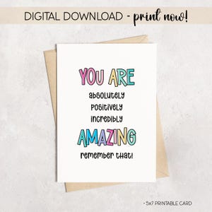 Può includere: Una scheda stampabile bianca con le parole "YOU ARE" in rosa e blu, seguite da "absolutely, positively, incredibly, AMAZING, remember that!" in testo colorato. La scheda è su una busta marrone. Il testo "DIGITAL DOWNLOAD - print now!" è in alto.