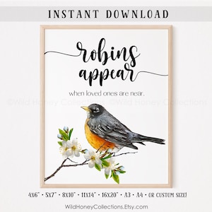 May include: Printable art print featuring a robin perched on a branch with white blossoms. The print has the text "robins appear when loved ones are near." and is available in various sizes, including 4x6 inches, 5x7 inches, 8x10 inches, 11x14 inches, 16x20 inches, A3, A4, or custom.
