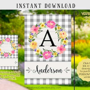 May include: A printable garden flag design featuring a wreath of flowers with a letter "A" in the center. The wreath is on a white wood background with a gray and white gingham pattern. The text "Anderson" is below the wreath. The design is available in 12x18 inches and includes a blank version for personalization.