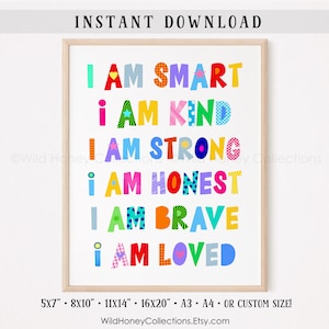 May include: Colorful printable wall art with the text "I am smart, I am kind, I am strong, I am honest, I am brave, I am loved". The text is in a variety of colors and fonts, and each letter is decorated with a different pattern. The art is framed in a light wood frame.
