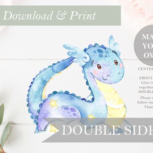 May include: A blue watercolor dragon with yellow accents and stars. The dragon is double-sided and can be used as a centerpiece. The text "Make Your Own Centerpieces!" and "Front & Back Glue two sides together to make Double Sided!" is also included.