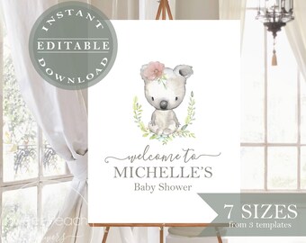 Op de afbeelding: Een afdrukbaar welkomsbord voor een babyshower met een aquarel-illustratie van een koala die een roze bloemenkrans draagt. Het bord zegt "Welkom op Michelle's babyshower".