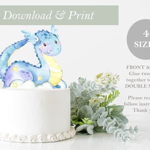 May include: A blue and purple watercolor dragon cake topper with stars and a yellow moon. The topper is on a white cake with a scalloped edge. The text "Download & Print" and "4 SIZES" is visible in the image. The text "FRONT & BACK Glue two sides together to make DOUBLE SIDED! Please read and follow instructions. Thank you!" is also visible.