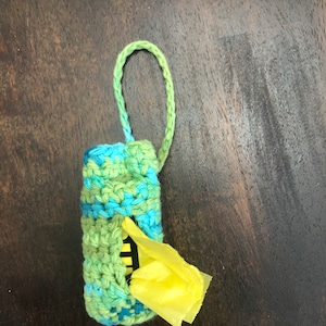 Poop Bag Holder-Dispenser includes 1 roll of bags