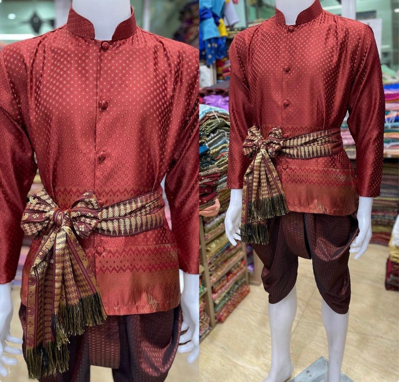 May include: A maroon long-sleeved shirt with a patterned design and a matching pair of pants. The shirt has a mandarin collar and a sash tied around the waist.
