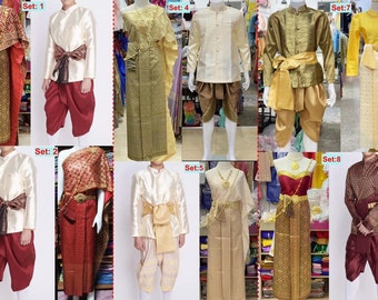 May include: Eight sets of traditional Thai clothing, each set featuring a long-sleeved shirt and pants for the male figure and a long skirt and shawl for the female figure. The clothing is in various colors and patterns, including gold, red, and green.