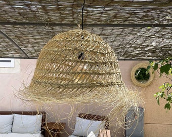 Openwork pendant light made of woven natural alfa straw
