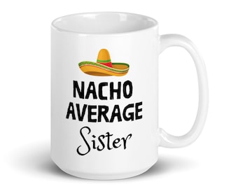 May include: White ceramic mug with a black and white graphic of a sombrero and the text "Nacho Average Sister".