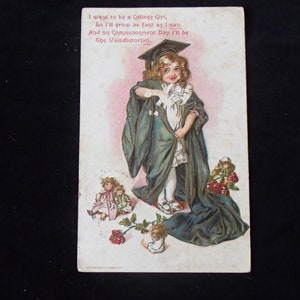 May include: A vintage postcard featuring a young girl dressed in a green graduation gown and cap. The girl is holding a scroll and smiling. The text on the postcard reads: "I want to be a College Girl, So I'll grow as fast as I can, And on Commencement Day I'll be The Valedictorian."