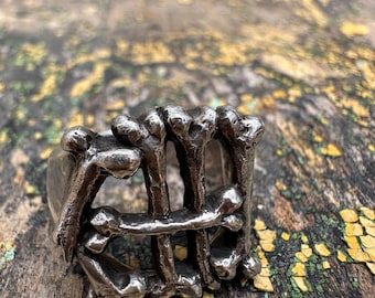 Custom sterling silver “CHI” ring with bold bone lettering—handcrafted tribute to Chicago style. Unique, urban, and made to last.