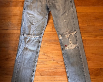 Vintage Levi's 90s Light Wash Jeans: Distressed Denim, 28x30