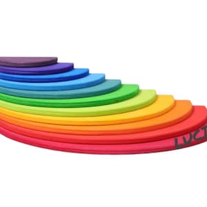 May include: A rainbow-colored wooden stacking toy with 10 semicircular pieces. The pieces are arranged in a rainbow pattern, with the largest piece at the bottom and the smallest piece at the top. The toy is made of natural wood and is finished with a non-toxic paint.